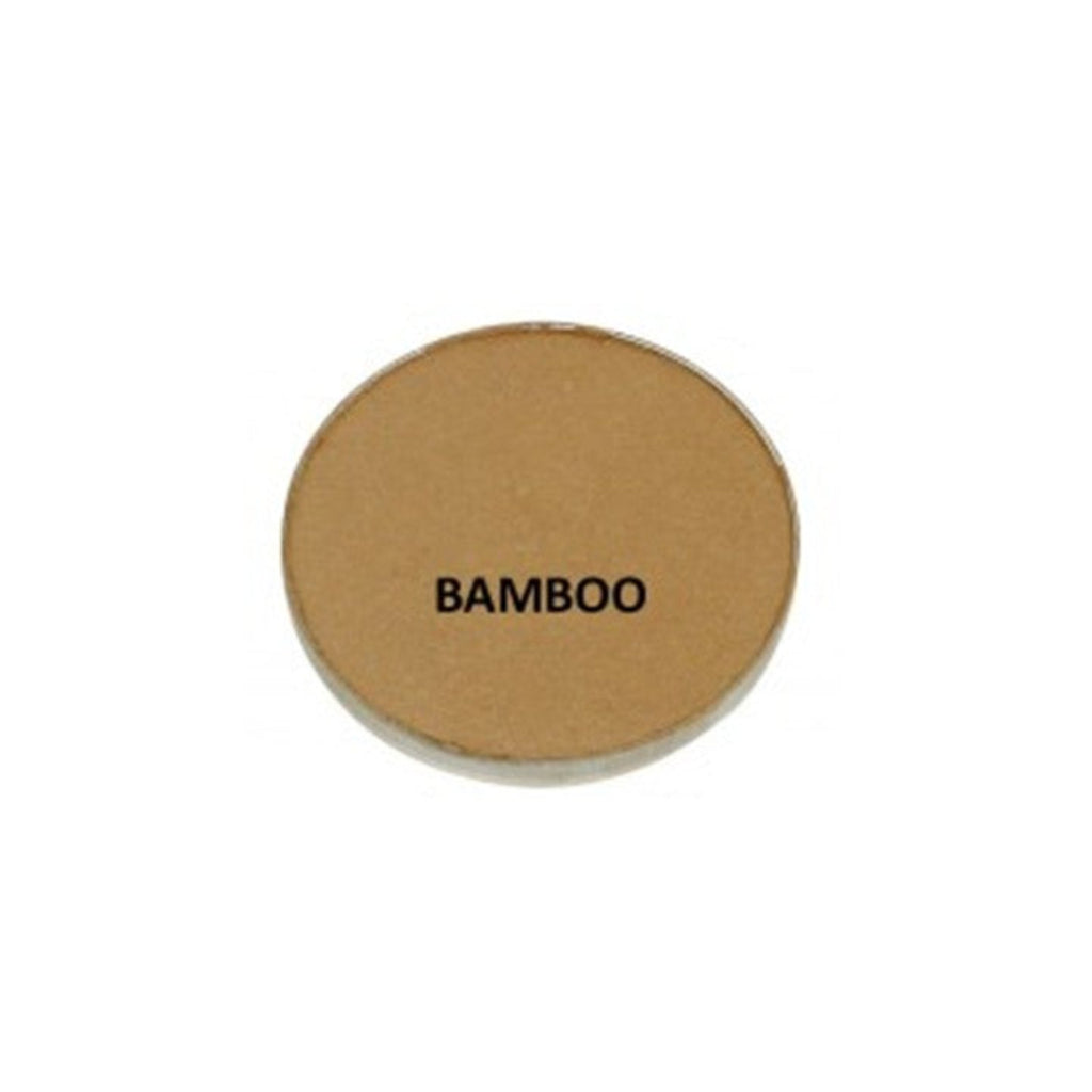 Round brown compact with 'BAMBOO' text on a white background