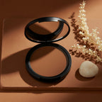 Bronzer Compact powder with 'Touch of Sun' text on a white background
