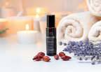 Mayuur essential oil bottle with lavender and dates on a blurred background
