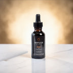 Mayuur elixir bottle on a white surface with a blurred background