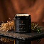 Mayuur Shaman Body Butter jar on a slate surface